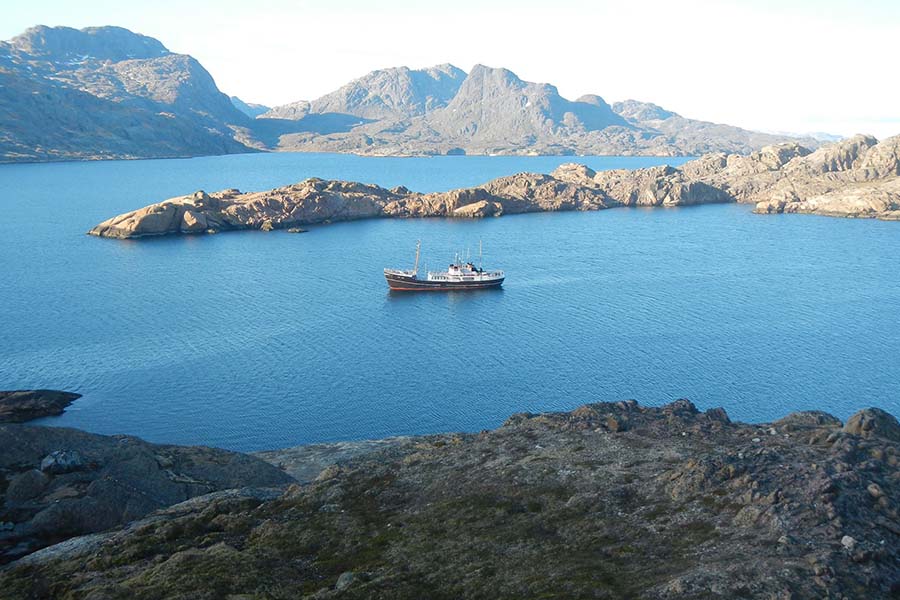 Togo in fjord with no ice 900x600
