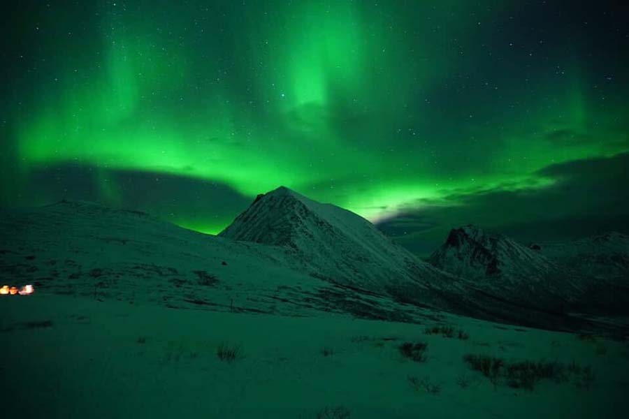 Togo northern lights from the vessel over mountain peek 900x600