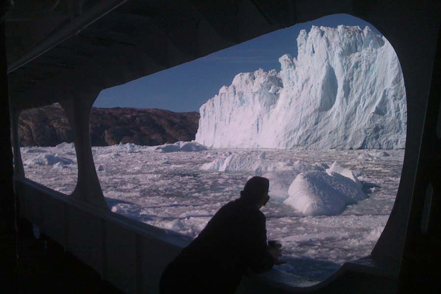 Togo passenger looking at iceberg 900x600